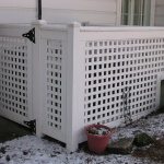 white whooden lattice picket fence